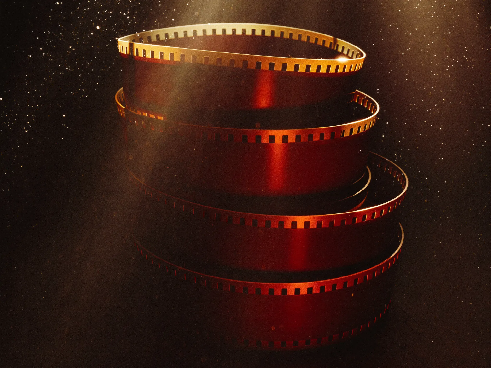 stack of film reels in amber light